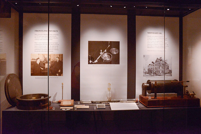 A central display showing Moseley's scientific apparatus